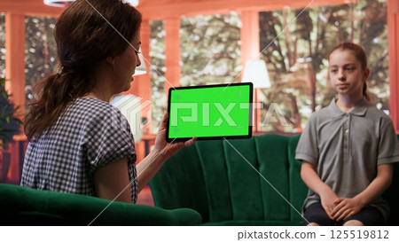 Teenager undergoing therapy for depression next to isolated chroma key screen, asking advice to boost self esteem. Psychologist expert guiding her to overcome her internal frustration. Camera B. 125519812