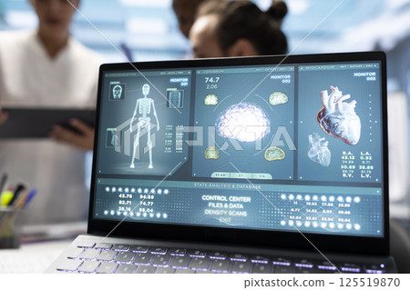 Cardiology experts team examine electrocardiogram test results and scans to develop effective treatment plan against a condition. Medical staff review analytics and hospital records. Close up. 125519870