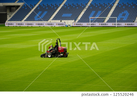 Soccer-only stadium: Mowing the grass before the match (Nagasaki Stadium) 125520246