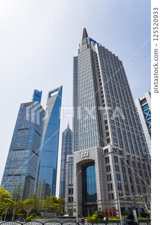 Shanghai, China - 1 April 2025: The iconic Jin Mao Tower and Shanghai Tower dominate the Pudong skyline under clear blue skies, showcasing Shanghai modern architectural prowess. Shanghai, China - 1 April 2025: The iconic Jin Mao Tower and Shanghai Tower dominate the Pudong skyline under clear blue skies, showcasing Shanghai modern architectural prowess. 125520933