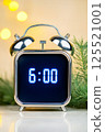 This modern digital alarm clock with bright blue LED digits shows the time as six oclock. It is positioned on a polished marble surface, complementing a luxurious home interior with subtle lighting 125521001