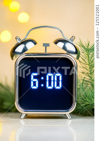 This modern digital alarm clock with bright blue LED digits shows the time as six oclock. It is positioned on a polished marble surface, complementing a luxurious home interior with subtle lighting This modern digital alarm clock with bright blue LED digits shows the time as six oclock. It is positioned on a polished marble surface, complementing a luxurious home interior with subtle lighting 125521001