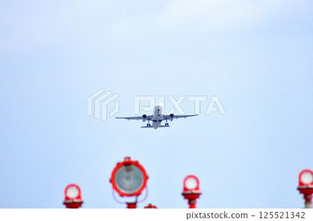 A plane taking off and guide lights / Naha Airport A plane taking off and guide lights / Naha Airport 125521342