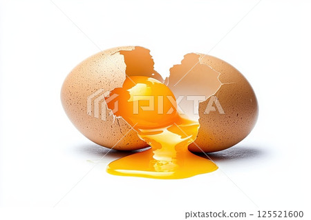 Cracked open eggshell with yolk spilling out, isolated on white background. Cracked open eggshell with yolk spilling out, isolated on white background. 125521600