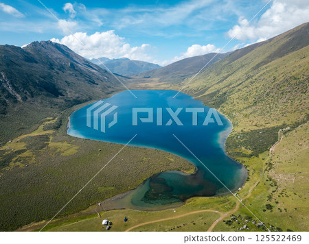 Aerial view of beautiful lake in high altitude mountains landscape Aerial view of beautiful lake in high altitude mountains landscape 125522469