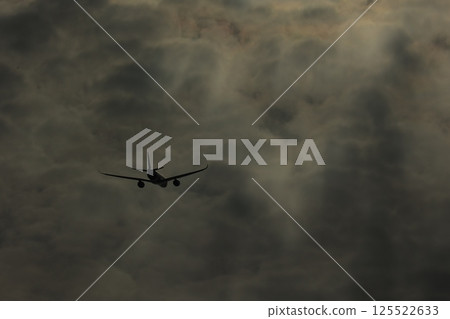 The sun seen through the gaps in the clouds 125522633