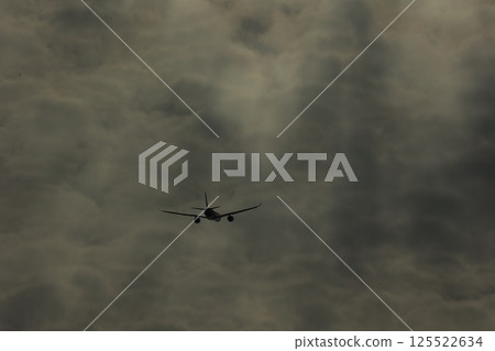 The sun seen through the gaps in the clouds 125522634