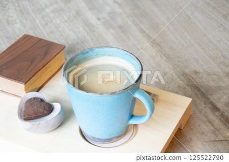 Hot Cappuccino In Cup On Wooden Table With Copy-space. The Latte Art On coffee background. 125522790