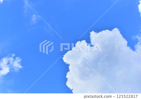 big cloud in clear blue sky background 125522817