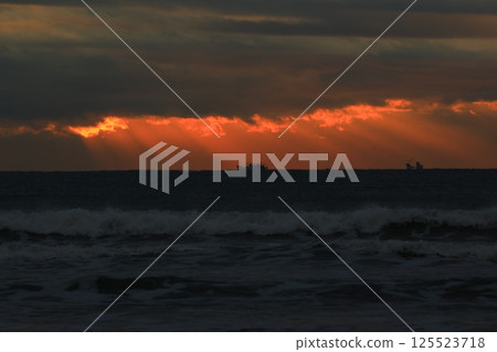 Angel's ladder pouring into the sea 125523718