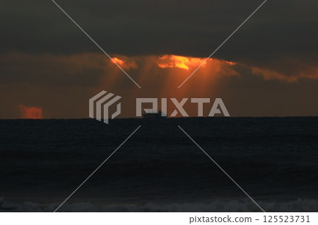 Angel's ladder pouring into the sea 125523731
