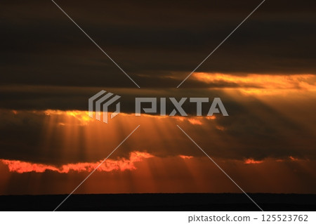 Angel's ladder pouring into the sea 125523762