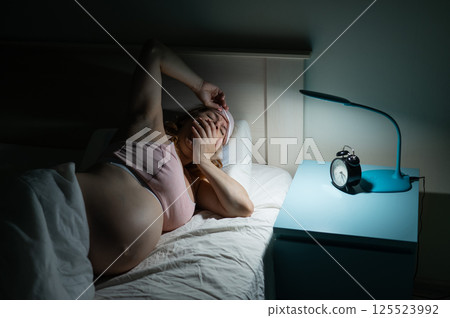 Pregnant woman suffers from insomnia.  125523992