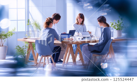 Smiling young business team in a bright office Smiling young business team in a bright office 125524447