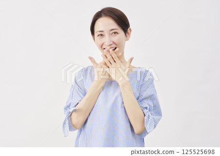 Woman, middle-aged, surprised with a smile, white background Woman, middle-aged, surprised with a smile, white background 125525698