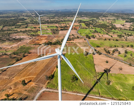 Wind energy and sustainable power generation with wind turbines, Eco-friendly solutions for renewable resources. Wind power farm and sustainable development of renewable energy, green technology. 125525843