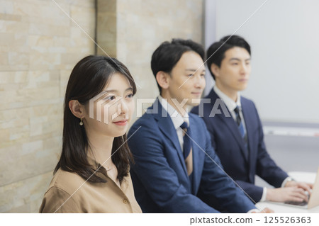 People having a meeting in a conference room 125526363