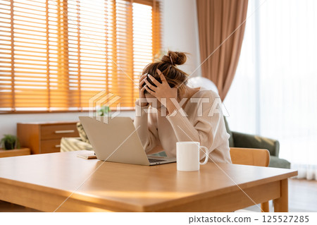 Office syndrome. Overworked tired young asian woman feeling headache Office syndrome. Overworked tired young asian woman feeling headache 125527285