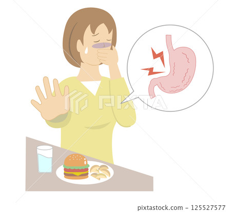 A young woman with an upset stomach holds her mouth with her hands and cannot eat 125527577