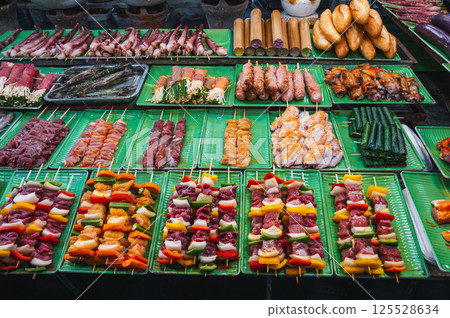 Traditional Vietnamese food on counter at Asian night market on the street in Vietnam in Asia in Da Nang 125528634