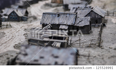 Miniature model of old wooden village showing rural life in pre-industrial Russia 125528991
