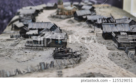 Miniature model of an old wooden village showing rural life in ancient times 125529051