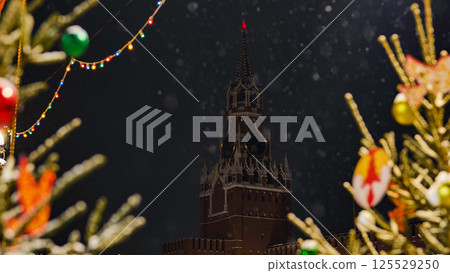 Snow falling on Spasskaya Tower during christmas night in Moscow Snow falling on Spasskaya Tower during christmas night in Moscow 125529250