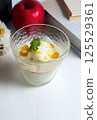 Ice cream with fruit sauce 125529361