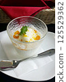 Ice cream with fruit sauce 125529362