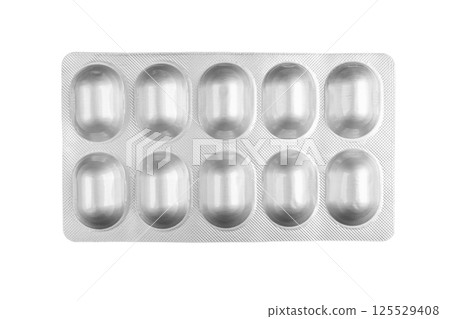 Macro shot pile of tablets pill in blister packaging isolated on white background. Silver aluminium foil blister pack. Pharmacy products. Medicine pills and drugs close up. Health care. Pills Macro shot pile of tablets pill in blister packaging isolated on white background. Silver aluminium foil blister pack. Pharmacy products. Medicine pills and drugs close up. Health care. Pills 125529408