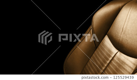 Modern Luxury car brown leather interior. Comfortable orange leather seats with stitching. Perforated leather interior Modern Luxury car brown leather interior. Comfortable orange leather seats with stitching. Perforated leather interior 125529439