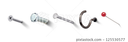 Nails, screws, bolts, pins, hooks stuck in the wall 125530577