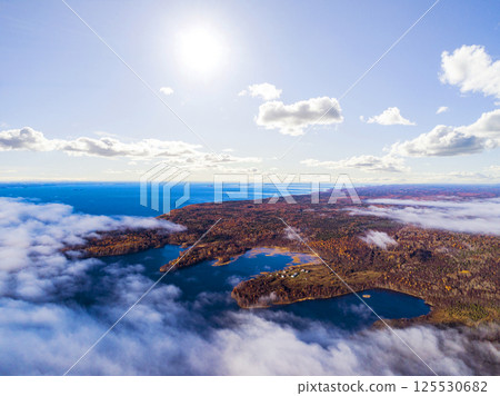 Aerial view of seashore with beach, lagoons. Coastline with sand and water. Landscape. Aerial photography. Birdseye. Sky, clouds. Stunning sky clouds. Sky landscape. 125530682