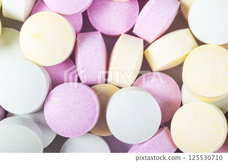 Colorful medicine pills and drugs in close up. Different kinds of multicolored tablets. Assorted pills in medicine. Pharmaceutical medicine pills and tablets. Health care. Pills background 125530710