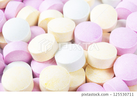 Colorful medicine pills and drugs in close up. Different kinds of multicolored tablets. Assorted pills in medicine. Pharmaceutical medicine pills and tablets. Health care. Pills background 125530711