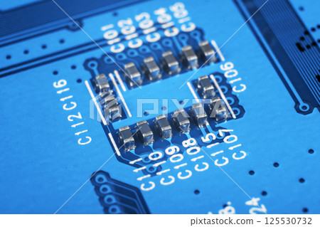 Macro shot of Circuit board with resistors microchips and electronic components. Computer hardware technology. Integrated communication processor. Information engineering. Semiconductor. PCB. Closeup Macro shot of Circuit board with resistors microchips and electronic components. Computer hardware technology. Integrated communication processor. Information engineering. Semiconductor. PCB. Closeup 125530732