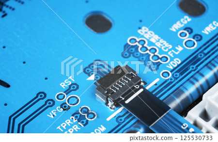 Macro shot of Circuit board with resistors microchips and electronic components. Computer hardware technology. Integrated communication processor. Information engineering. Semiconductor. PCB. Closeup Macro shot of Circuit board with resistors microchips and electronic components. Computer hardware technology. Integrated communication processor. Information engineering. Semiconductor. PCB. Closeup 125530733
