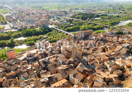 Aerial townscape of Fraga with view of Cinca River 125531054