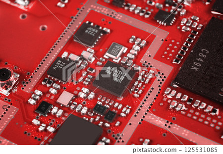 Macro shot of Circuit board with resistors microchips and electronic components. Computer hardware technology. Integrated communication processor. Information engineering. Semiconductor. PCB. Closeup Macro shot of Circuit board with resistors microchips and electronic components. Computer hardware technology. Integrated communication processor. Information engineering. Semiconductor. PCB. Closeup 125531085