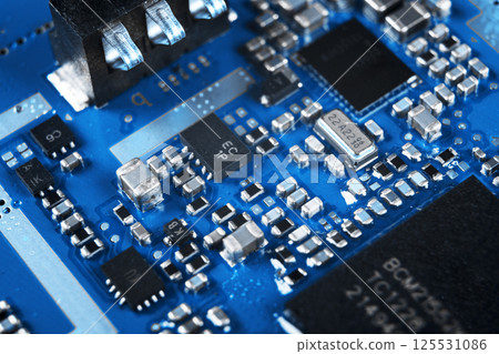 Macro shot of Circuit board with resistors microchips and electronic components. Computer hardware technology. Integrated communication processor. Information engineering. Semiconductor. PCB. Closeup 125531086