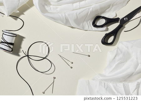 needlework set on beige background 125531223