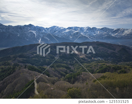 View of the majestic Ushiro-Tateyama mountain range from Shirasawa Pass, Hakuba Village, Nagano Prefecture (aerial shot by drone) 125531525