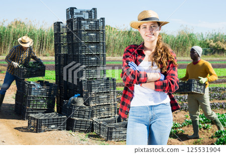 Portrait of woman farmer standing at the farm field Portrait of woman farmer standing at the farm field 125531904
