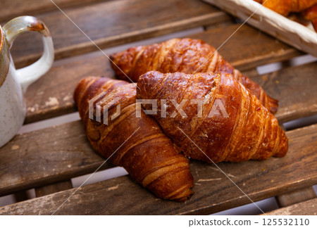 Fresh tasty croissants - pastries for delicious breakfast 125532110