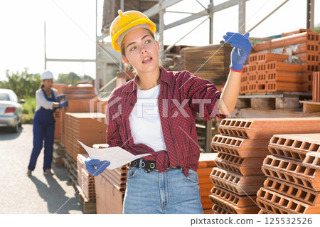Female worker calling out for someone 125532526