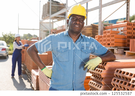 Builder in outoor warehouse Builder in outoor warehouse 125532587