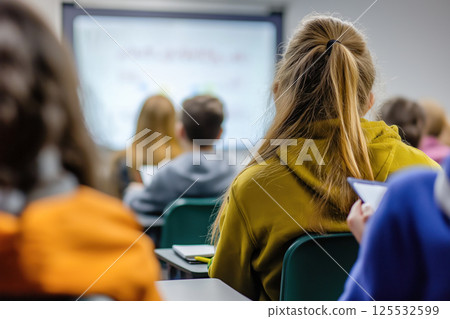 Blurred View of a Classroom with Students. Back View of Classroom Setting 125532599