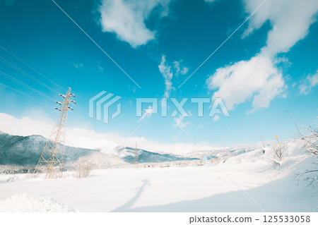 Clear blue sky and pure white snow 125533058