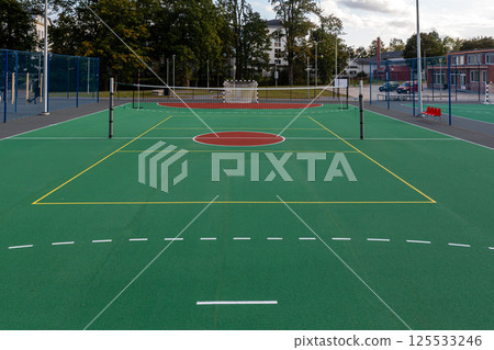 New multi-sport court opened at local park featuring basketball and tennis facilities New multi-sport court opened at local park featuring basketball and tennis facilities 125533246