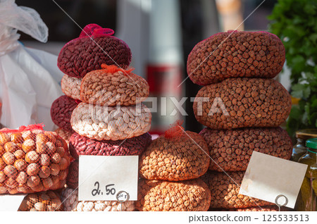 Colorful display of traditional snacks for sale at an outdoor market in autumn Colorful display of traditional snacks for sale at an outdoor market in autumn 125533513